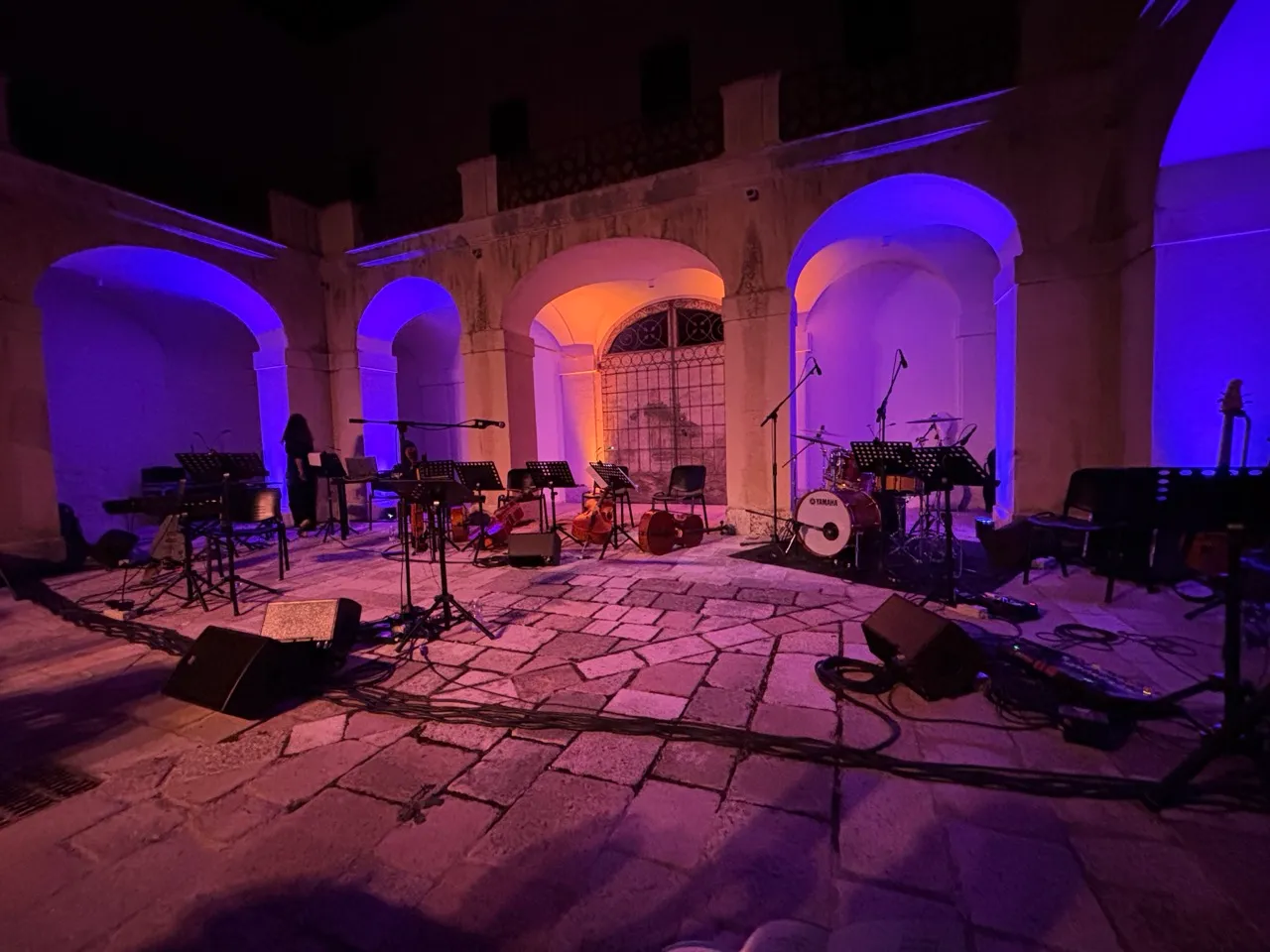 Courtyard at night, brick, prepared for band with lights